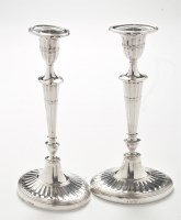 Lot 209 - A pair of Edward VII silver candlesticks, by...