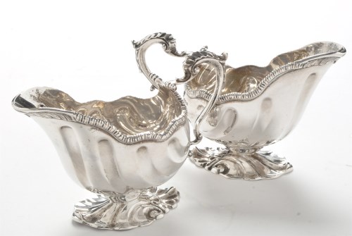 Lot 243 - A pair of matched silver gravy boats, by...