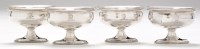 Lot 260 - A set of four George III silver table salts,...