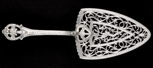 Lot 263 - An ornate George III silver fish slice, by...