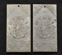 Lot 316 - Two Chinese white metal plaques, with relief...