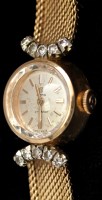Lot 330 - Cymaflex: an 18k and diamond wristwatch, the...