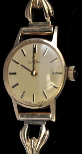 Lot 336 - Omega: a 9ct. yellow gold cocktail watch, with...