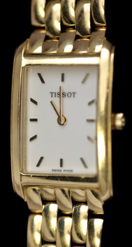 Lot 343 - Tissot: an 18k lady's wristwatch, with...