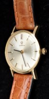 Lot 344 - Omega: a lady's 9ct. gold cased wristwatch,...