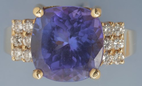 Lot 371 - A tanzanite and diamond ring, the slightly...