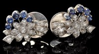 Lot 383 - A pair of sapphire and diamond stud earrings,...