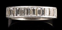 Lot 390 - A diamond ring, the ten baguette cut diamonds...