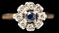 Lot 409 - A sapphire and diamond cluster ring, the...
