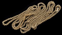 Lot 426 - A yellow metal muff chain, of beaded fancy...