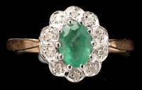 Lot 432 - An emerald and diamond cluster ring, the oval...