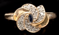 Lot 435 - A sapphire and diamond ring, the marquise cut...
