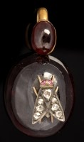 Lot 438 - A garnet, ruby and diamond set pendant, the...
