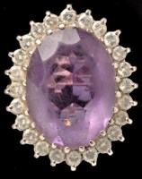 Lot 440 - An amethyst and diamond cluster ring, the oval...