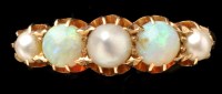 Lot 455 - An opal and pearl ring, the two opal beads...