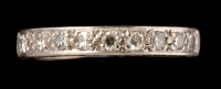 Lot 461 - A half hoop nine stone eternity ring, the...