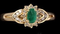 Lot 465 - An emerald and diamond cluster ring, the oval...