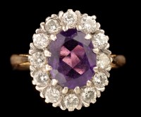 Lot 466 - An amethyst and diamond cluster ring, the oval...