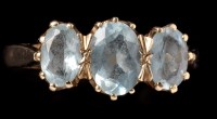 Lot 470 - A three stone aquamarine ring, the three...