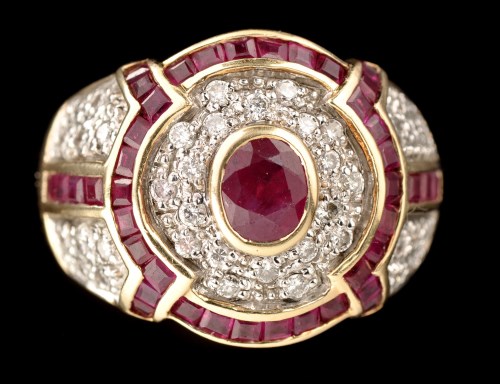 Lot 471 - A ruby and diamond dress ring, the central...