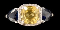 Lot 474 - A yellow sapphire, diamond and blue sapphire...