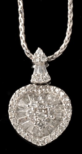 Lot 476 - A diamond heart-shaped pendant, set with forty...