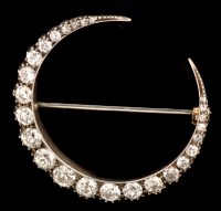 Lot 480 - A Victorian diamond crescent brooch, set with...