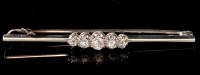 Lot 482 - A five stone diamond bar brooch, the graduated...