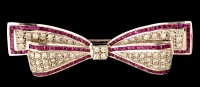 Lot 483 - An Art Deco style ruby and diamond bow pattern...