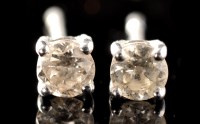 Lot 491 - A pair of diamond stud earrings, each set...