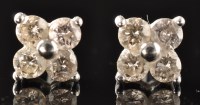 Lot 492 - A pair of diamond stud earrings, each set with...