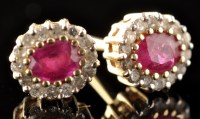 Lot 496 - A pair of ruby and diamond cluster stud...