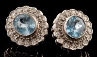 Lot 498 - A pair of aquamarine and diamond cluster stud...