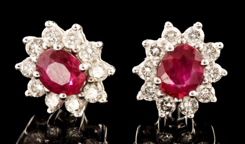 Lot 500 - A pair of ruby and diamond cluster earrings,...