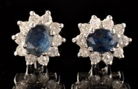 Lot 503 - A pair of sapphire and diamond cluster stud...