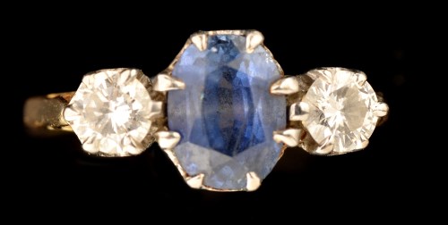 Lot 504 - A sapphire and diamond ring, the oval facet...