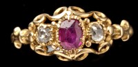 Lot 510 - A ruby and diamond ring, the oval facet cut...