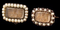 Lot 511 - Two 19th Century memorium brooches, each set...