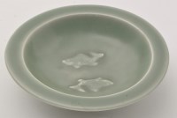 Lot 600 - Chinese Celadon 'twin fish' dish, the interior...