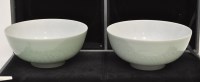 Lot 612 - Pair of carved Chinese celadon bowls, the...