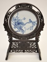 Lot 614 - Chinese blue and white circular panel, with...