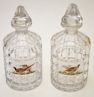 Lot 665 - Pair of cut glass 'Shooting' decanters and...