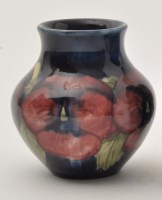 Lot 687 - Moorcroft 'Pansy' squat vase, on mottled blue...