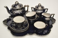 Lot 734 - Silver metal mounted blue glaze fourteen-piece...