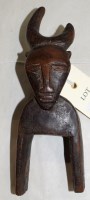 Lot 774 - A West African guro heddle pulley, with bovine...