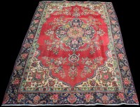 Lot 790 - A Tabriz style carpet, the central floral...