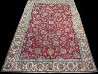 Lot 792 - A Tabriz carpet, the claret ground with full...