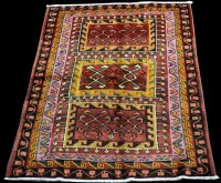 Lot 799 - A Persian rug, the claret ground decorated...