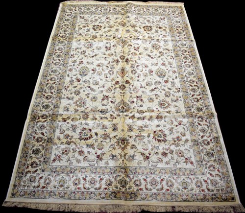Lot 807 - A woven Kashmir carpet, with full floral...