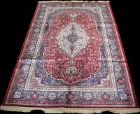 Lot 808 - A woven Kashmir carpet, the central...